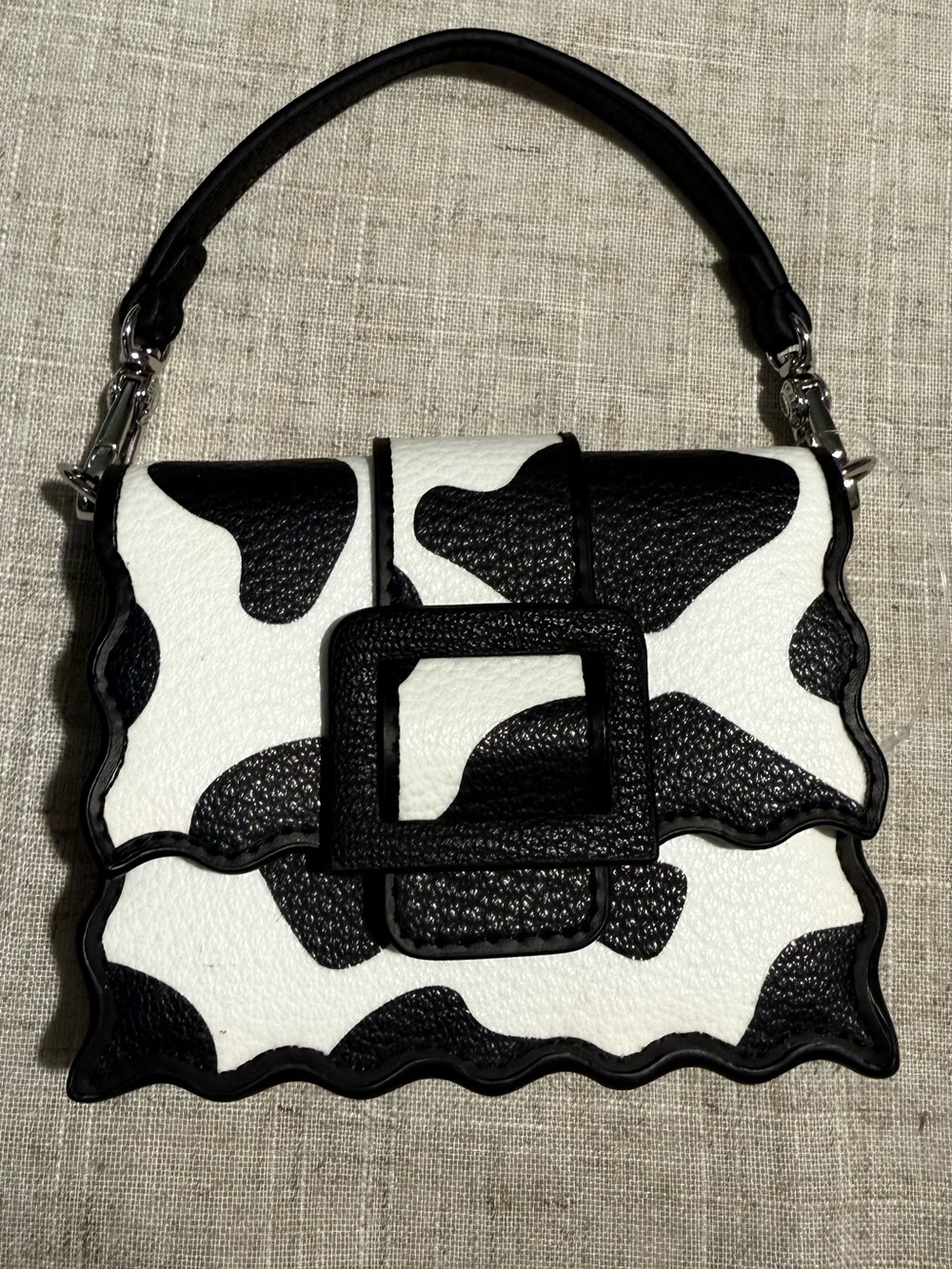 Charles & Keith Black & White Cowhide-Pattern Top Handle mini crossbody Bag